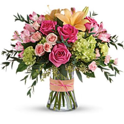 <div id="mark-3" class="m-pdp-tabs-marketing-description">Put a spring in their step with this beautifully blushing bouquet of hot pink roses, soft peach lilies and fresh green hydrangea. Arranged in a graceful vase tied with a charming bow, it's a chic treat for any occasion!</div>
<div id="desc-3">
<ul>
 	<li>This sweet arrangement features green hydrangea, hot pink roses, pink spray roses, peach asiatic lilies, pink alstroemeria, green carnations, pink miniature carnations, seeded eucalyptus, parvifolia eucalyptus, and lemon leaf.</li>
</ul>
</div>