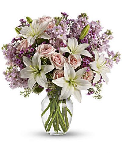<div id="mark-3" class="m-pdp-tabs-marketing-description">Put your love into the season's most romantic flowers - light pink roses, fragrant white asiatic lilies and other favorites in a dazzling clear glass vase. Love will blossom in the most intoxicating way for a full week. You'll both enjoy it.</div>
<div id="desc-3">
<ul>
<li>This spectacular bouquet includes light pink spray roses, white asiatic lilies, lavender stock and lavender waxflower accented with assorted greenery.</li>
</ul>
</div>