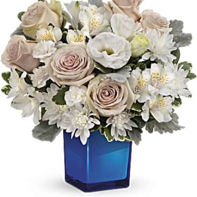 <div id="mark-3" class="m-pdp-tabs-marketing-description">Bursting with gorgeous roses and blooms, this cobalt glass cube vase is a gorgeous gift that can also serve as a beautiful candleholder!</div>
<div id="desc-3">This splendid bouquet features crème roses, white cushion spray chrysanthemums, white lisianthus, white alstroemeria, miniature white carnations, dusty miller and variegated pittosporum.</div>
