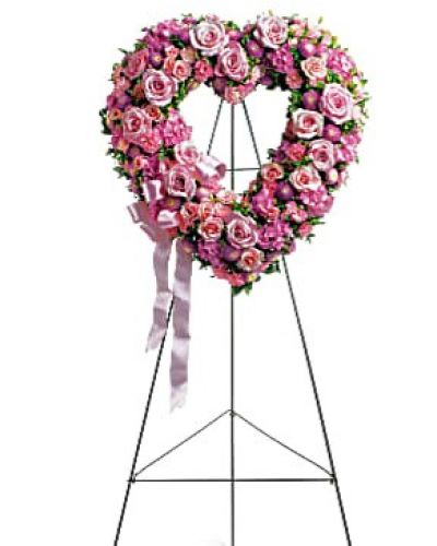<div id="mark-1" class="m-pdp-tabs-marketing-description">In the shape of a heart, and accented with a pink satin ribbon, this garden of delicate blooms is a tender and classic tribute to a precious life, and a cherished expression of love and sympathy.</div>
<div id="desc-1">
<ul>
 	<li>Beautiful flowers such as light pink roses, hydrangea and miniature carnations mix with lavender chrysanthemums on an open heart-shaped wreath.</li>
</ul>
</div>