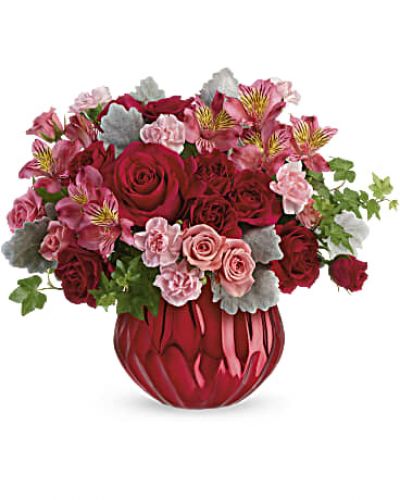 Pure enchantment! Sparkling like a rare gemstone, this alluring ceramic vase has a bold metallic finish that captures the light beneath a lovely red and pink bouquet.  Flowers and/or container may be substituted as close as possible if product is out of stock.