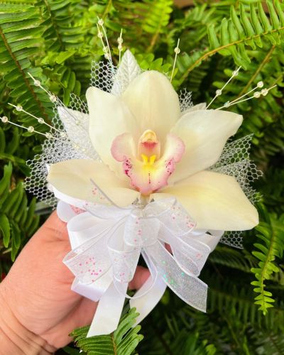 <p>MOTHER'S DAY CORSAGES CUSTOM MADE BY Doris Tanner's Flowers! Mom will feel special wearing the orchid in honor of her own mom. Tradition is that she will wear white orchid if her mom is deceased and a colored orchid if her mom is still living. Call today! limited number available!</p>