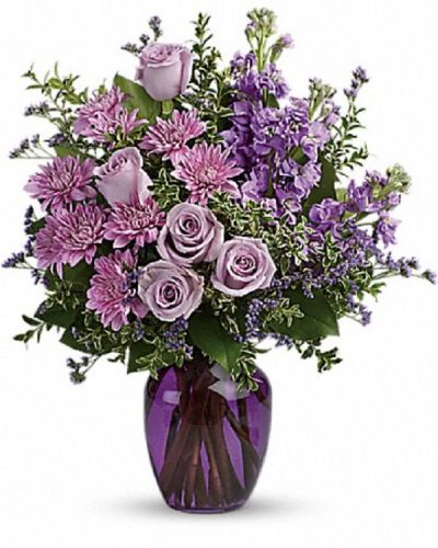 <div class="m-pdp-tabs-description">
<div id="mark-1" class="m-pdp-tabs-marketing-description">Capture the magic of togetherness with this bountiful bouquet of enchanting lavender roses. Artfully arranged in a glass vase, its twilight hues are sure to brighten anyone's day!</div>
</div>
<p id="arrngDescp">This dramatic arrangement includes lavender roses, lavender stock, lavender cushion spray chrysanthemums, lavender limonium, oregonia and lemon leaf. Delivered in a purple glass vase.</p>