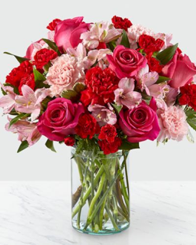 <p>Handcrafted and inspired by the gorgeous hues of the season, the You’re Precious Bouquet is full of sweet sentiment for your favorite person. Hot pink roses, red carnations, pink alstroemeria, and pale pink carnations come together in a clear glass vase to make any room feel beautiful and light. From special birthdays to simply just because, this arrangement is a stunning gift to give your loved ones for every occasion.</p>