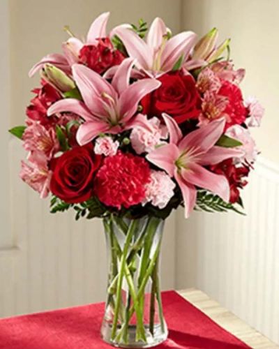 Bring the love and beauty of flowers straight to your special recipient's door. The Forever and a Day Bouquet brings together an impressive array of blushing pink and red blooms creating an unforgettable rush of romance.
