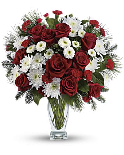 <p>No mistletoe required! Simply send this romantic bouquet of snow whites and rich reds arranged in our sculpted glass vase, and you’re guaranteed a spot on her “nice” list.</p>
<p>This heartwarming bouquet includes red roses, red carnations, red miniature carnations, white matsumoto asters, white cushion chrysanthemums, noble fir, white pine and lemon leaf.</p>