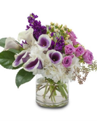 <p>Pure joy. Best wishes. Send them both with this radiant bouquet featuring purple stock, spray roses and calla lilies.</p>