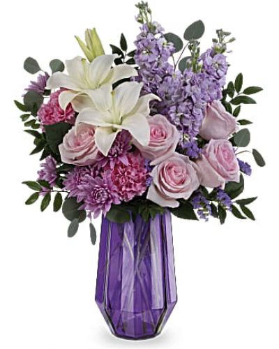 Wish her a Mother's Day of wonder and whimsy with Teleflora's Lavender Whimsy Bouquet featuring a breathtaking rose and lily bouquet in this stunning geometric glass vase.